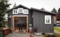 A single-car garage converted into a tiny house with a sleeping loft. | www.facebook.com/SmallHouseBliss