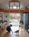 A single-car garage converted into a tiny house with a sleeping loft. | www.facebook.com/SmallHouseBliss