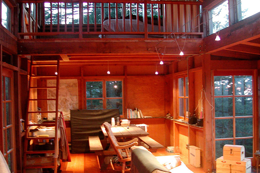 Reminiscent of forest fire lookout towers, this 672 sq ft cabin has two separate sleeping lofts. | www.facebook.com/SmallHouseBliss