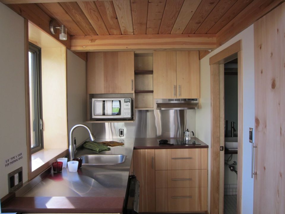 The Mini-B, a tiny house built to the Passive House standard for ultra-high energy-efficiency. It is a 300 sq ft studio with a sleeping loft. | www.facebook.com/SmallHouseBliss