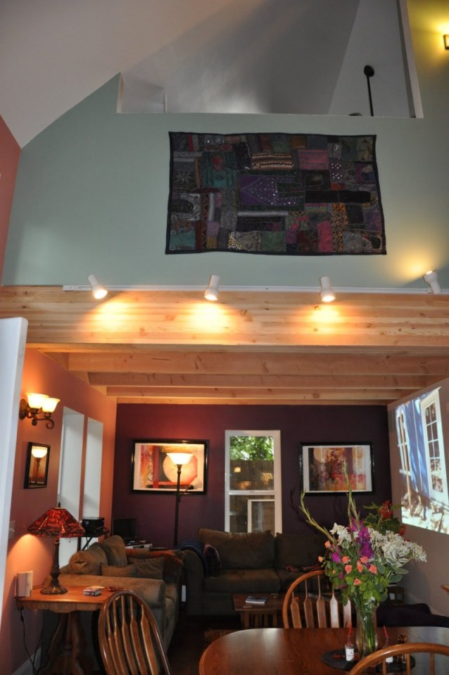 This shingled backyard cottage has 1 bedroom and a small office in 799 sq ft. | www.facebook.com/SmallHouseBliss