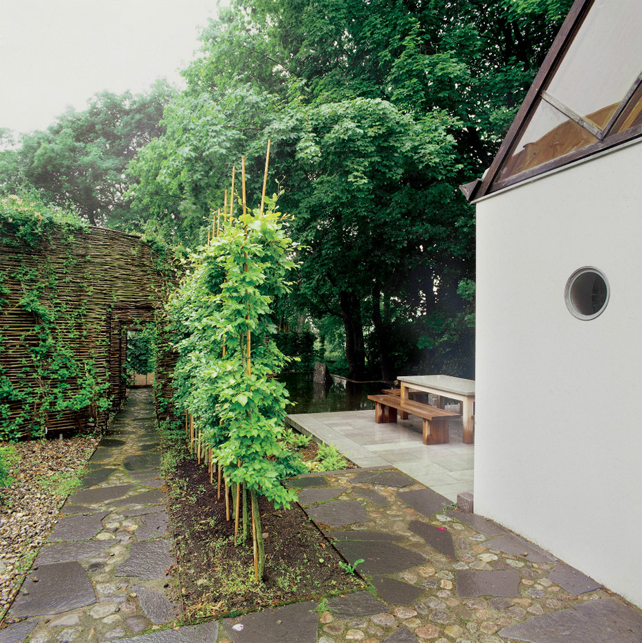 The Mill House, a finely-crafted guest house set among beautiful water features and lush landscaping. It has one bedroom and a sauna in 538 sq ft. | www.facebook.com/SmallHouseBliss