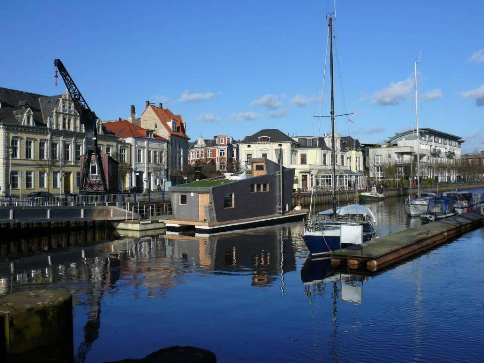 The Silberfisch, a modern floating home with 431 sq ft on the main deck plus a sleeping loft. | www.facebook.com/SmallHouseBliss