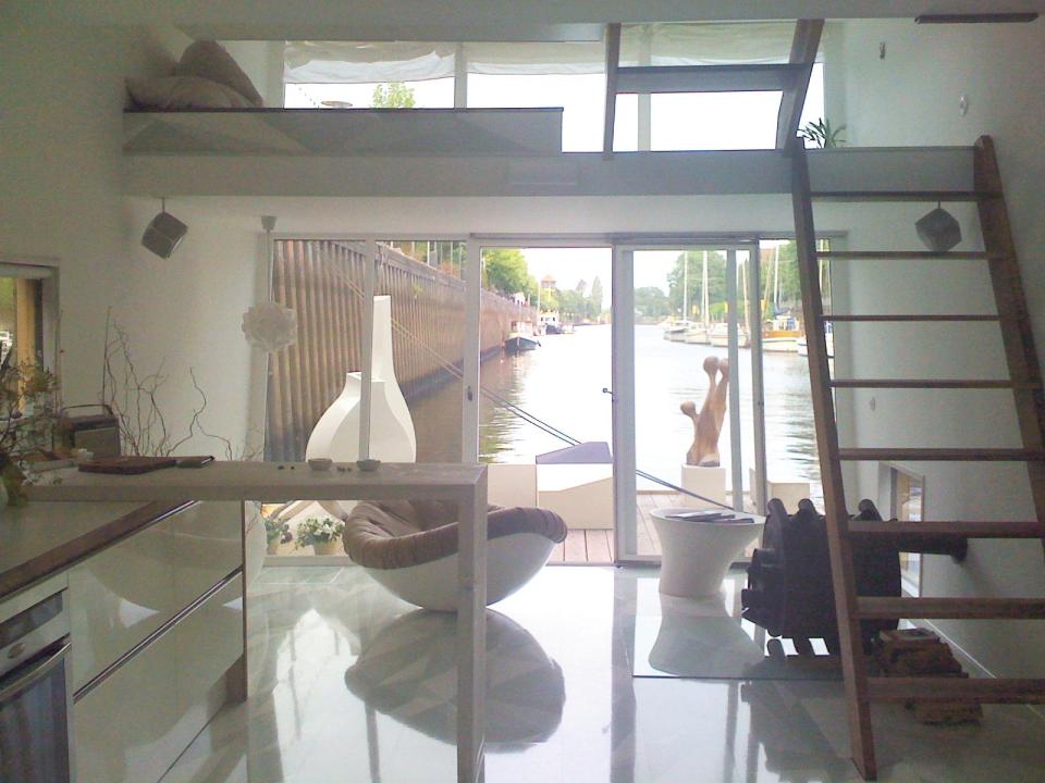 The Silberfisch, a modern floating home with 431 sq ft on the main deck plus a sleeping loft. | www.facebook.com/SmallHouseBliss