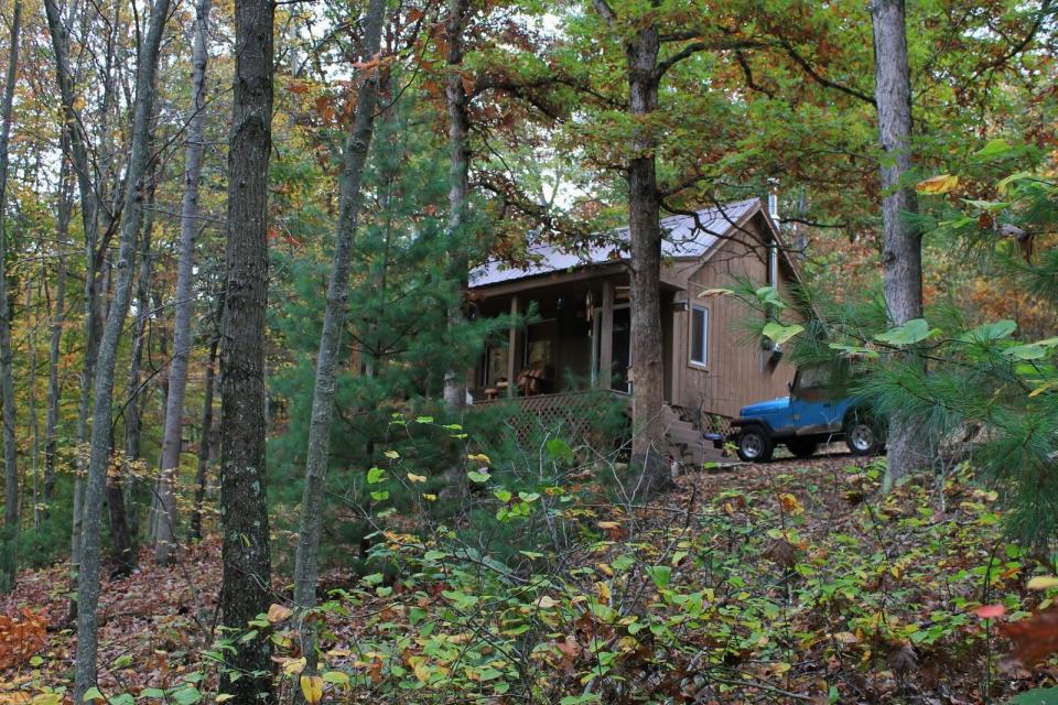 Dave Fosson's "ManCamp" cabin in the woods is 16' by 24' and has a sleeping loft. | www.facebook.com/SmallHouseBliss