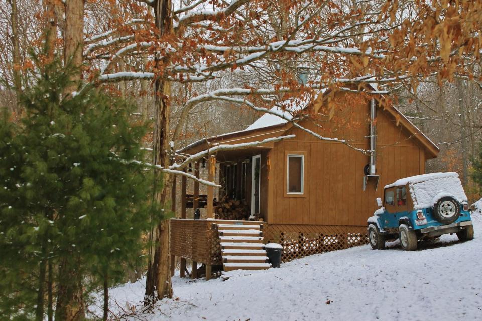 Dave Fosson's "ManCamp" cabin in the woods is 16' by 24' and has a sleeping loft. | www.facebook.com/SmallHouseBliss