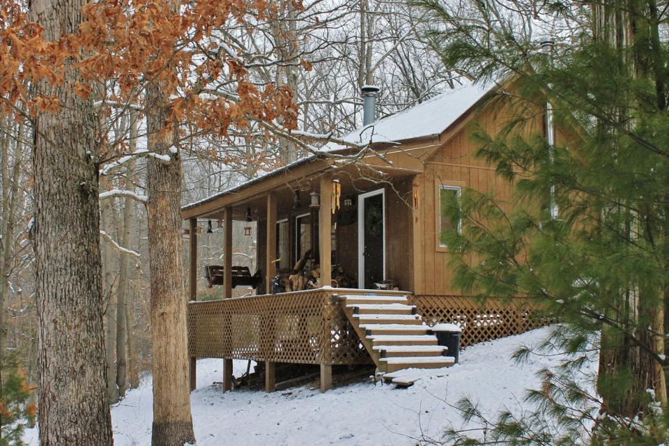 Dave Fosson's "ManCamp" cabin in the woods is 16' by 24' and has a sleeping loft. | www.facebook.com/SmallHouseBliss