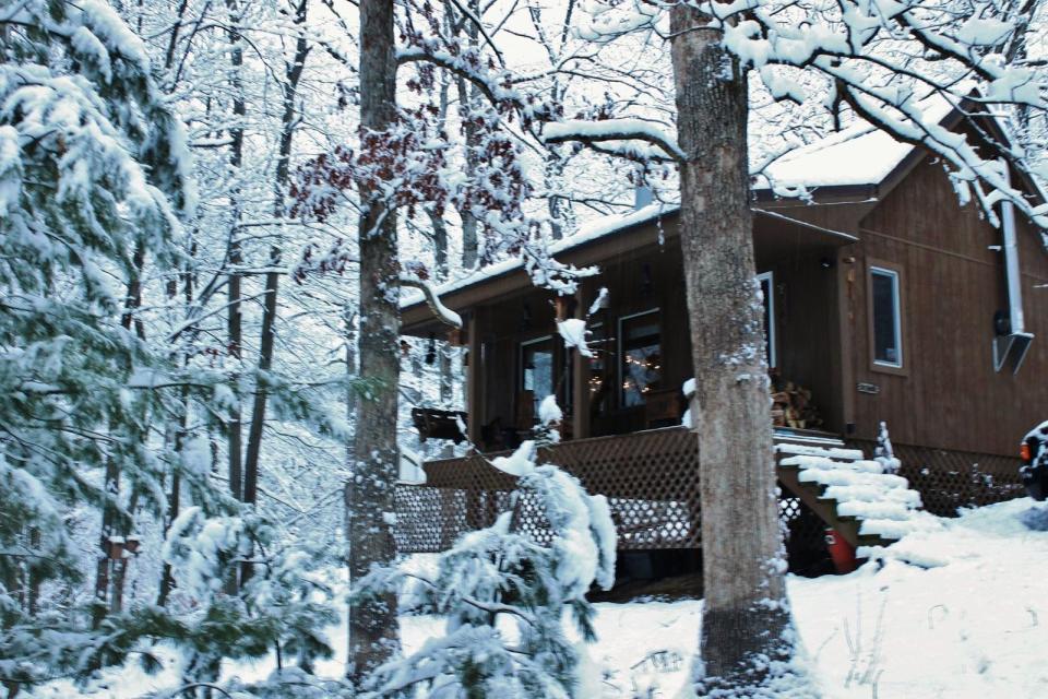 Dave Fosson's "ManCamp" cabin in the woods is 16' by 24' and has a sleeping loft. | www.facebook.com/SmallHouseBliss