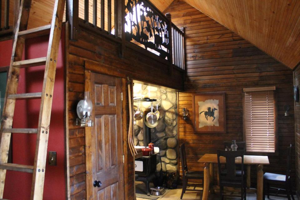 Dave Fosson's "ManCamp" cabin in the woods is 16' by 24' and has a sleeping loft. | www.facebook.com/SmallHouseBliss