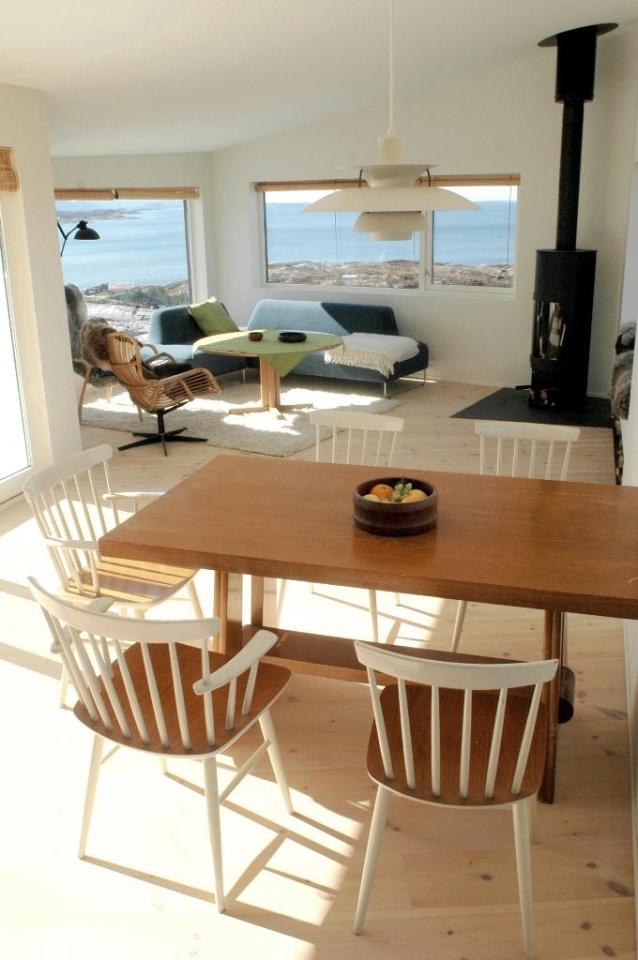 An irregular horseshoe-shaped floor plan provides shelter from the wind for this family cabin in Norway. It has 3 bedrooms in 829 sq ft. | www.facebook.com/SmallHouseBliss