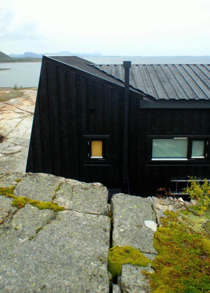 An irregular horseshoe-shaped floor plan provides shelter from the wind for this family cabin in Norway. It has 3 bedrooms in 829 sq ft. | www.facebook.com/SmallHouseBliss