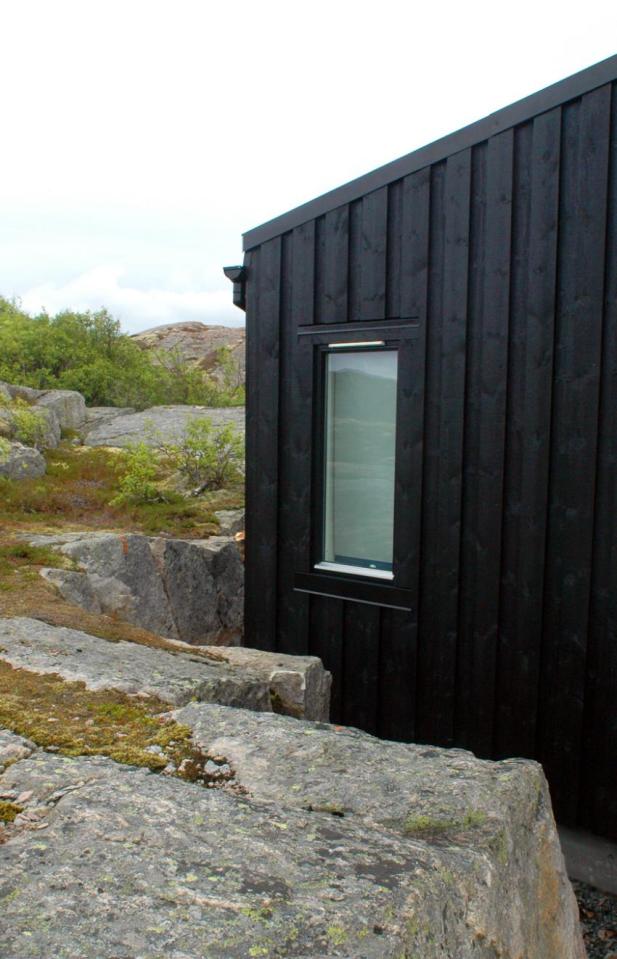 An irregular horseshoe-shaped floor plan provides shelter from the wind for this family cabin in Norway. It has 3 bedrooms in 829 sq ft. | www.facebook.com/SmallHouseBliss