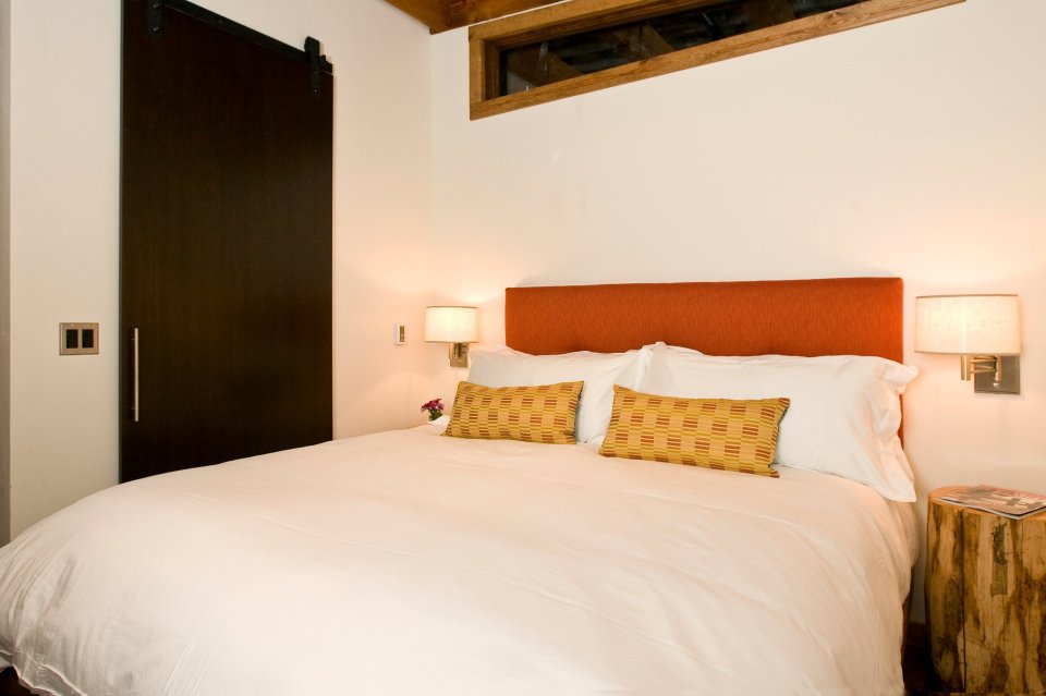 The WheelHaus Wedge, a small cabin on wheels. The "rustic modern" cabin has one bedroom in 400 sq ft. | www.facebook.com/SmallHouseBliss