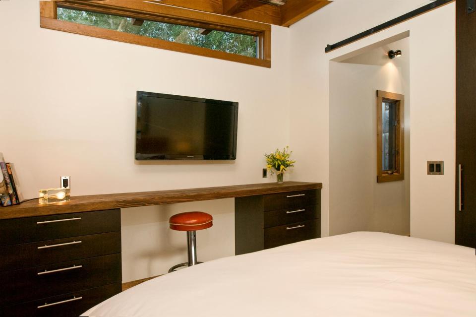 The WheelHaus Wedge, a small cabin on wheels. The "rustic modern" cabin has one bedroom in 400 sq ft. | www.facebook.com/SmallHouseBliss