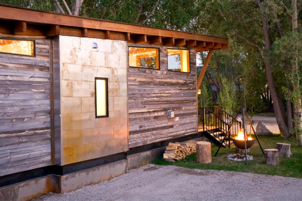 The WheelHaus Wedge, a small cabin on wheels. The "rustic modern" cabin has one bedroom in 400 sq ft. | www.facebook.com/SmallHouseBliss