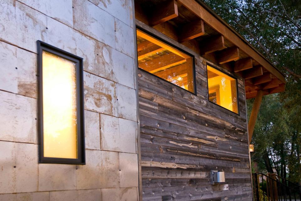 The WheelHaus Wedge, a small cabin on wheels. The "rustic modern" cabin has one bedroom in 400 sq ft. | www.facebook.com/SmallHouseBliss