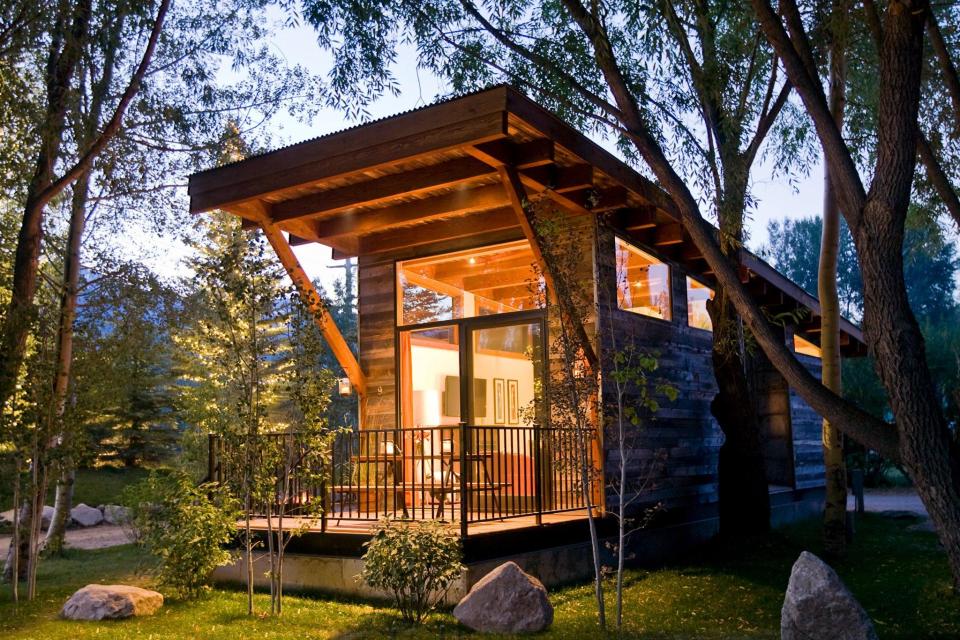 The WheelHaus Wedge, a small cabin on wheels. The "rustic modern" cabin has one bedroom in 400 sq ft. | www.facebook.com/SmallHouseBliss