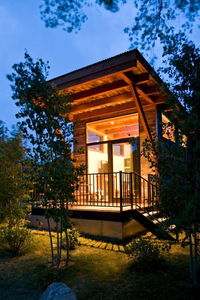 The WheelHaus Wedge, a small cabin on wheels. The "rustic modern" cabin has one bedroom in 400 sq ft. | www.facebook.com/SmallHouseBliss