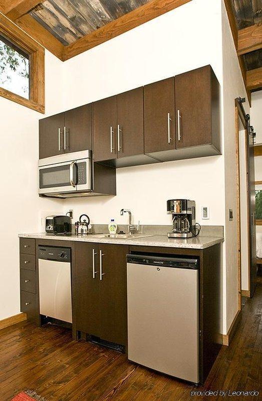 The WheelHaus Wedge, a small cabin on wheels. The "rustic modern" cabin has one bedroom in 400 sq ft. | www.facebook.com/SmallHouseBliss