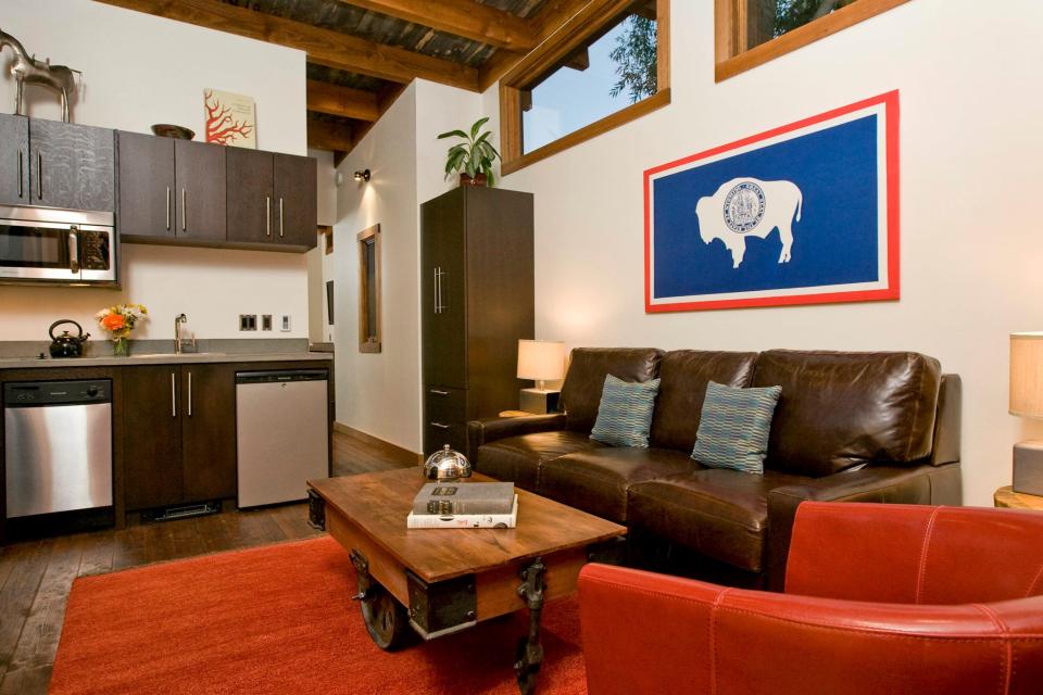 The WheelHaus Wedge, a small cabin on wheels. The "rustic modern" cabin has one bedroom in 400 sq ft. | www.facebook.com/SmallHouseBliss