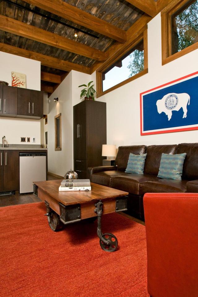 The WheelHaus Wedge, a small cabin on wheels. The "rustic modern" cabin has one bedroom in 400 sq ft. | www.facebook.com/SmallHouseBliss