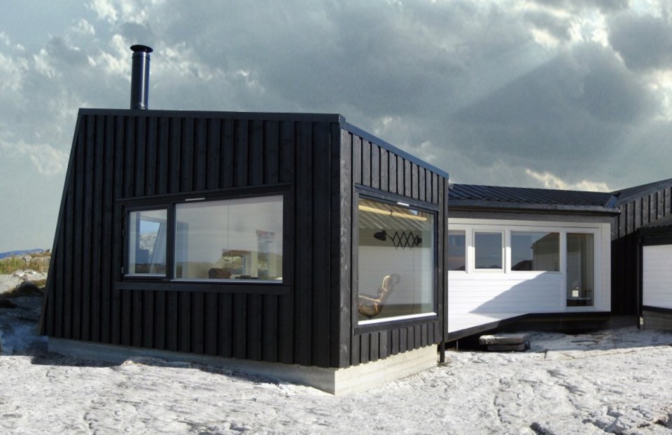 An irregular horseshoe-shaped floor plan provides shelter from the wind for this family cabin in Norway. It has 3 bedrooms in 829 sq ft. | www.facebook.com/SmallHouseBliss