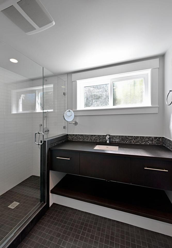 A small laneway house designed to blend with its traditional neighbors. The 400 sq ft cottage is a studio design with a sleeping loft. | www.facebook.com/SmallHouseBliss