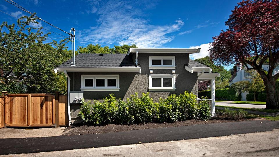 A small laneway house designed to blend with its traditional neighbors. The 400 sq ft cottage is a studio design with a sleeping loft. | www.facebook.com/SmallHouseBliss