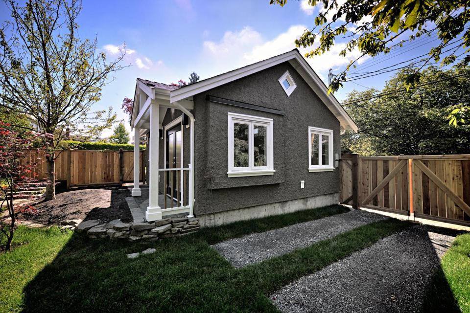 A small laneway house designed to blend with its traditional neighbors. The 400 sq ft cottage is a studio design with a sleeping loft. | www.facebook.com/SmallHouseBliss