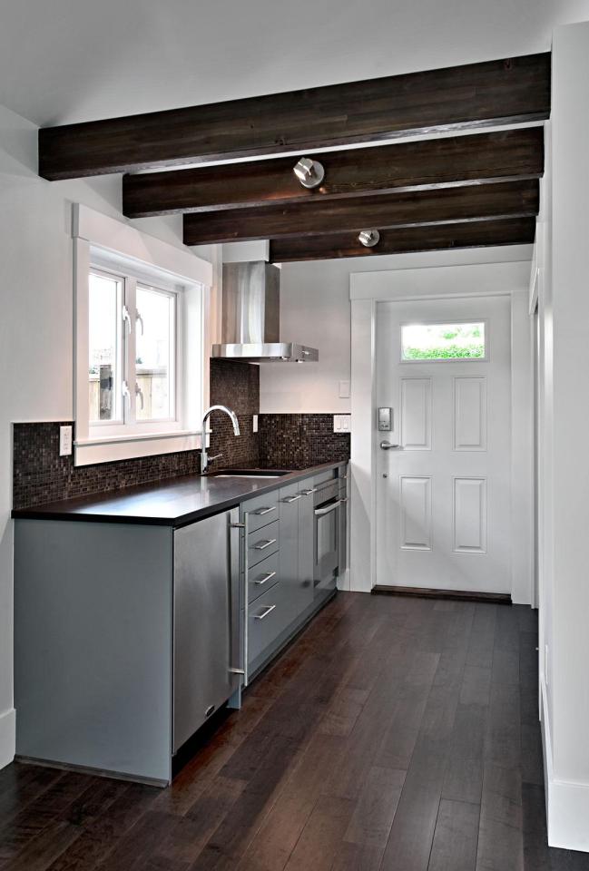 A small laneway house designed to blend with its traditional neighbors. The 400 sq ft cottage is a studio design with a sleeping loft. | www.facebook.com/SmallHouseBliss