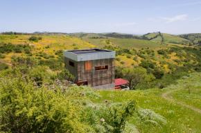 A small modern cabin built with straw bales. | www.facebook.com/SmallHouseBliss