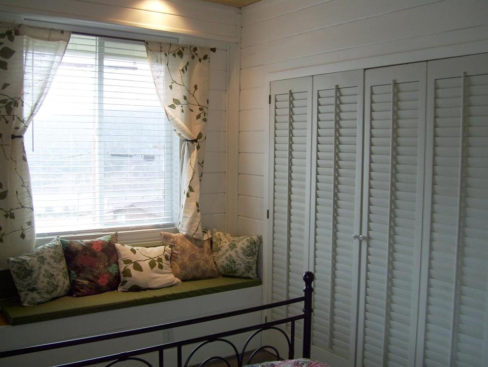 AnnaMarie's Cottage, a small owner-built home with custom hand-crafted features. It has one bedroom in 716 sq ft. | www.facebook.com/SmallHouseBliss