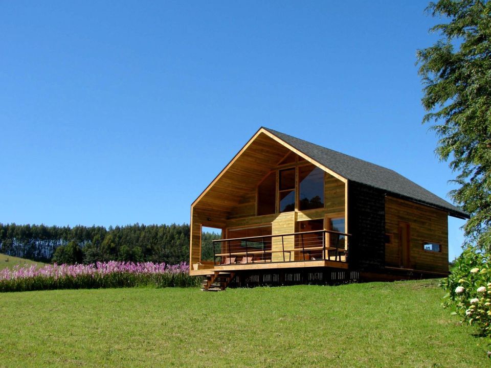 Cabaña Bascuñan, a family vacation house with a surprising and playful design. It has two bedrooms and a very large loft in 1,184 sq ft. | www.facebook.com/SmallHouseBliss