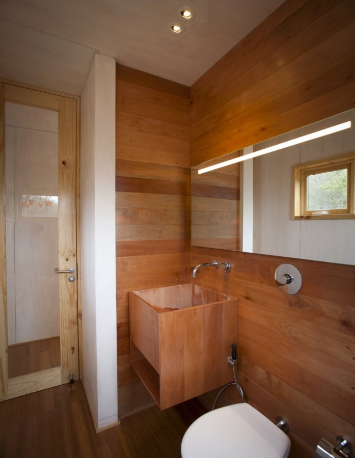 Refugio Pangal, a simple modern cabin in Chile with one bedroom and a loft in 646 sq ft. | www.facebook.com/SmallHouseBliss