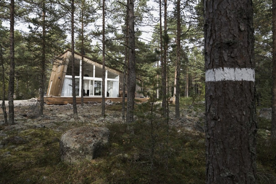 This modern resort cabin in Sweden has a design inspired by camping tents. It has two bedrooms and a loft in 969 sq ft. | www.facebook.com/SmallHouseBliss