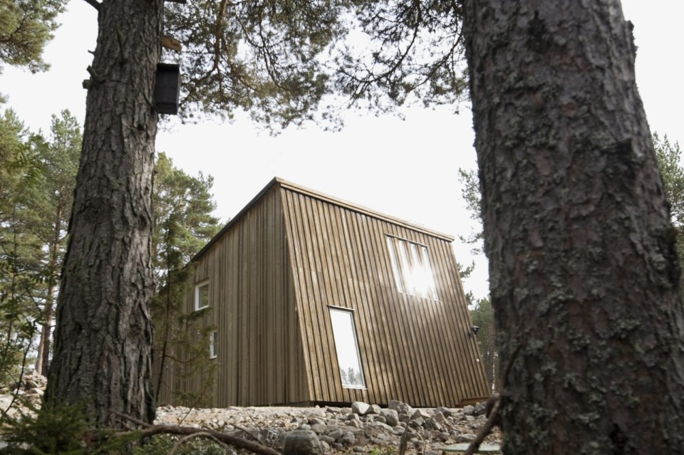 This modern resort cabin in Sweden has a design inspired by camping tents. It has two bedrooms and a loft in 969 sq ft. | www.facebook.com/SmallHouseBliss
