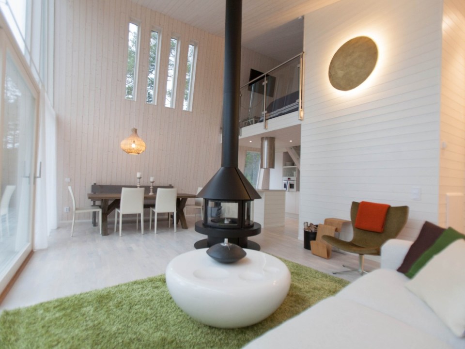 This modern resort cabin in Sweden has a design inspired by camping tents. It has two bedrooms and a loft in 969 sq ft. | www.facebook.com/SmallHouseBliss