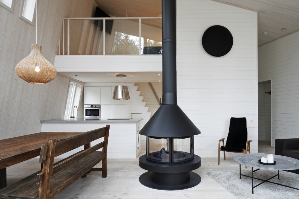 This modern resort cabin in Sweden has a design inspired by camping tents. It has two bedrooms and a loft in 969 sq ft. | www.facebook.com/SmallHouseBliss