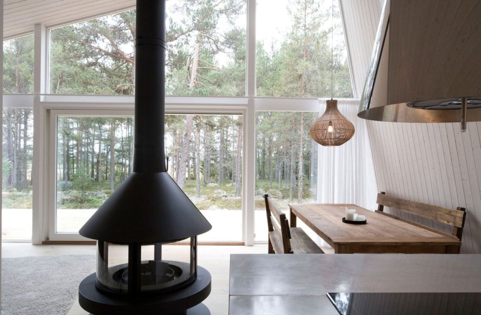 This modern resort cabin in Sweden has a design inspired by camping tents. It has two bedrooms and a loft in 969 sq ft. | www.facebook.com/SmallHouseBliss