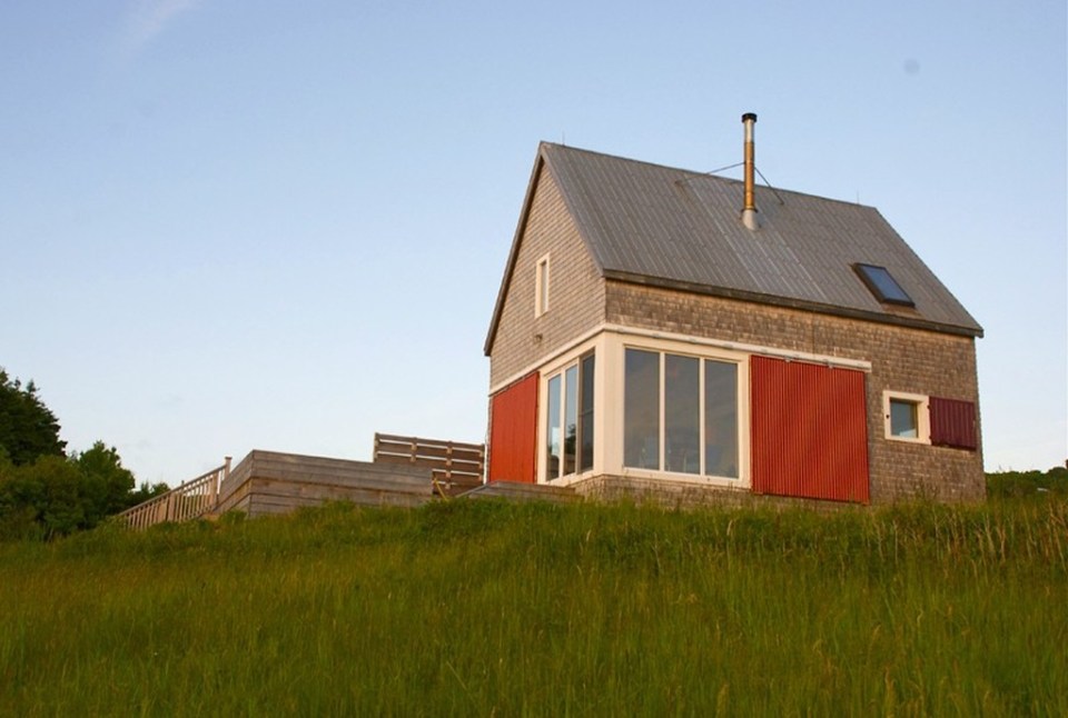 Sea and Sky Cottage on Cape Breton updates the traditional Maritime gable-roofed, shingled house with an open interior. It is 860 sq ft with a lofted bedroom. | www.facebook.com/SmallHouseBliss