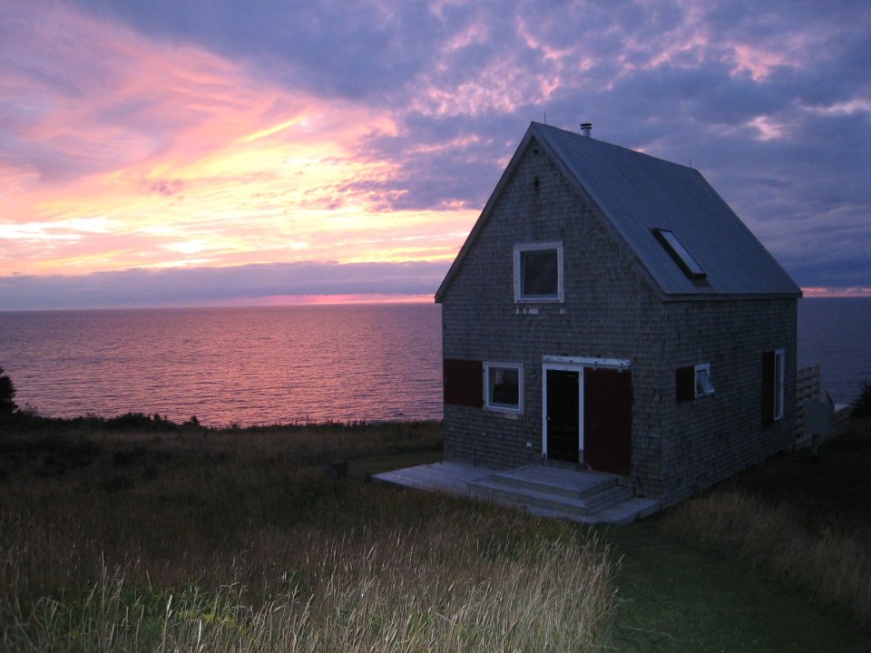 Sea and Sky Cottage on Cape Breton updates the traditional Maritime gable-roofed, shingled house with an open interior. It is 860 sq ft with a lofted bedroom. | www.facebook.com/SmallHouseBliss