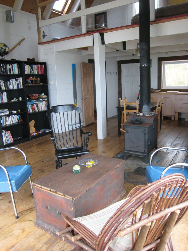 Sea and Sky Cottage on Cape Breton updates the traditional Maritime gable-roofed, shingled house with an open interior. It is 860 sq ft with a lofted bedroom. | www.facebook.com/SmallHouseBliss