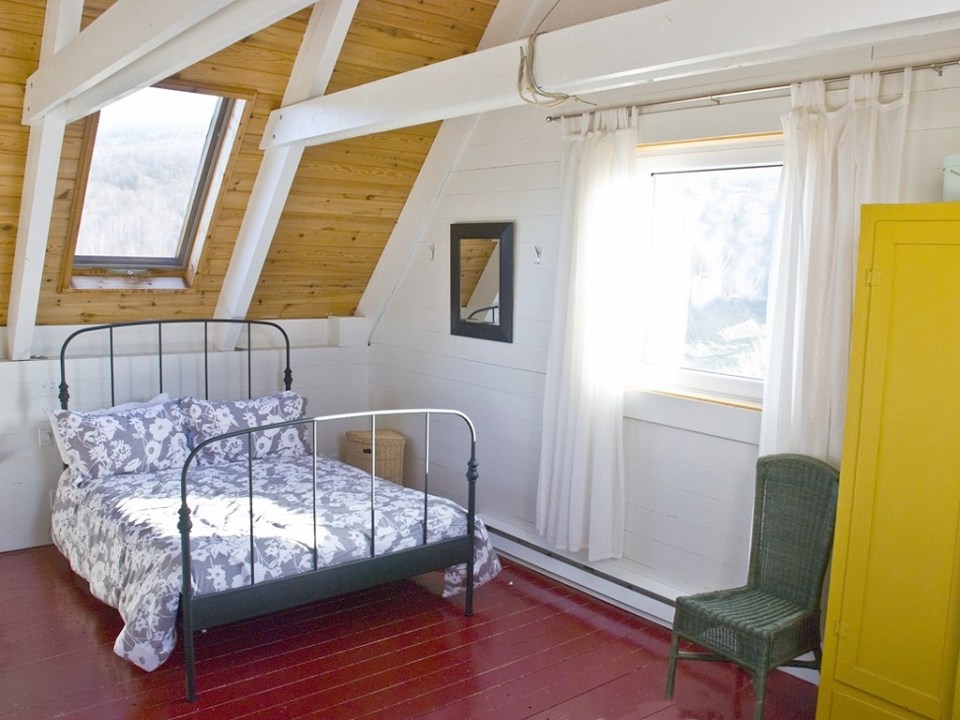 Sea and Sky Cottage on Cape Breton updates the traditional Maritime gable-roofed, shingled house with an open interior. It is 860 sq ft with a lofted bedroom. | www.facebook.com/SmallHouseBliss