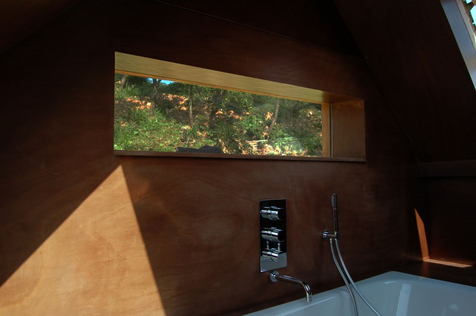 The remnants of a tiny stone cottage were restored and expanded with a small addition. It now has 334 sq ft downstairs and one bedroom up. | www.facebook.com/SmallHouseBliss