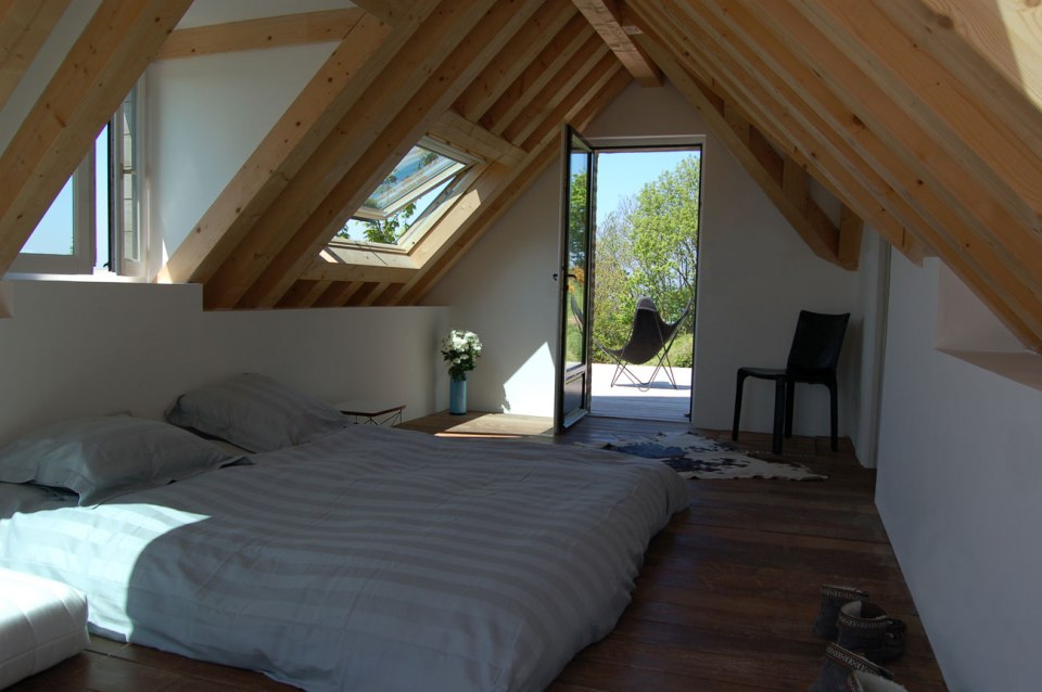 The remnants of a tiny stone cottage were restored and expanded with a small addition. It now has 334 sq ft downstairs and one bedroom up. | www.facebook.com/SmallHouseBliss