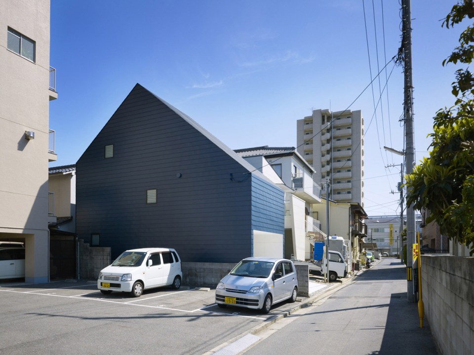 With neighbors close by and no good views, this small house has few windows. Instead, a huge skylight floods the living space with daylight. The house has two bedrooms and a loft in 807 sq ft. | www.facebook.com/SmallHouseBliss