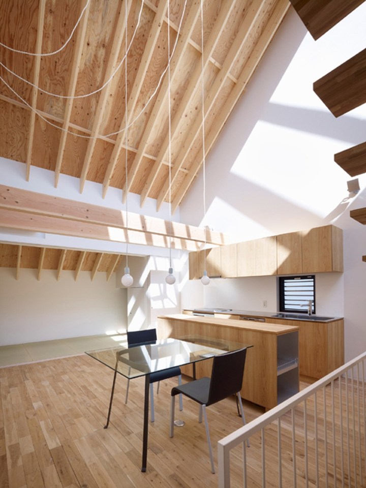 With neighbors close by and no good views, this small house has few windows. Instead, a huge skylight floods the living space with daylight. The house has two bedrooms and a loft in 807 sq ft. | www.facebook.com/SmallHouseBliss