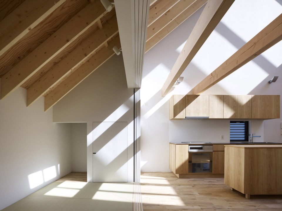 With neighbors close by and no good views, this small house has few windows. Instead, a huge skylight floods the living space with daylight. The house has two bedrooms and a loft in 807 sq ft. | www.facebook.com/SmallHouseBliss