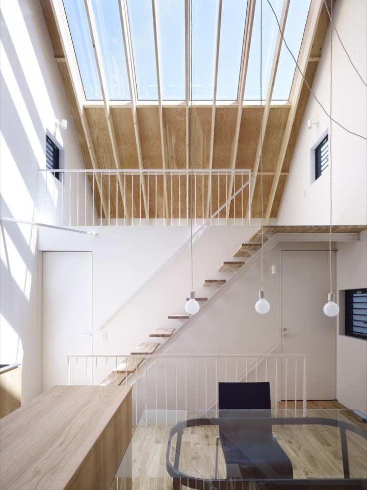 With neighbors close by and no good views, this small house has few windows. Instead, a huge skylight floods the living space with daylight. The house has two bedrooms and a loft in 807 sq ft. | www.facebook.com/SmallHouseBliss