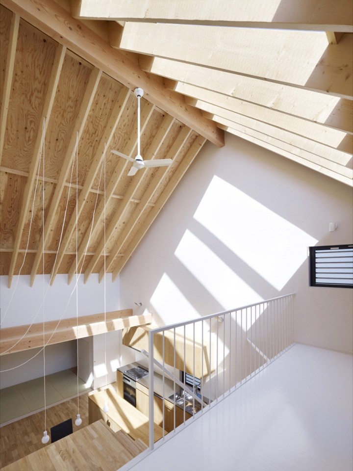 With neighbors close by and no good views, this small house has few windows. Instead, a huge skylight floods the living space with daylight. The house has two bedrooms and a loft in 807 sq ft. | www.facebook.com/SmallHouseBliss